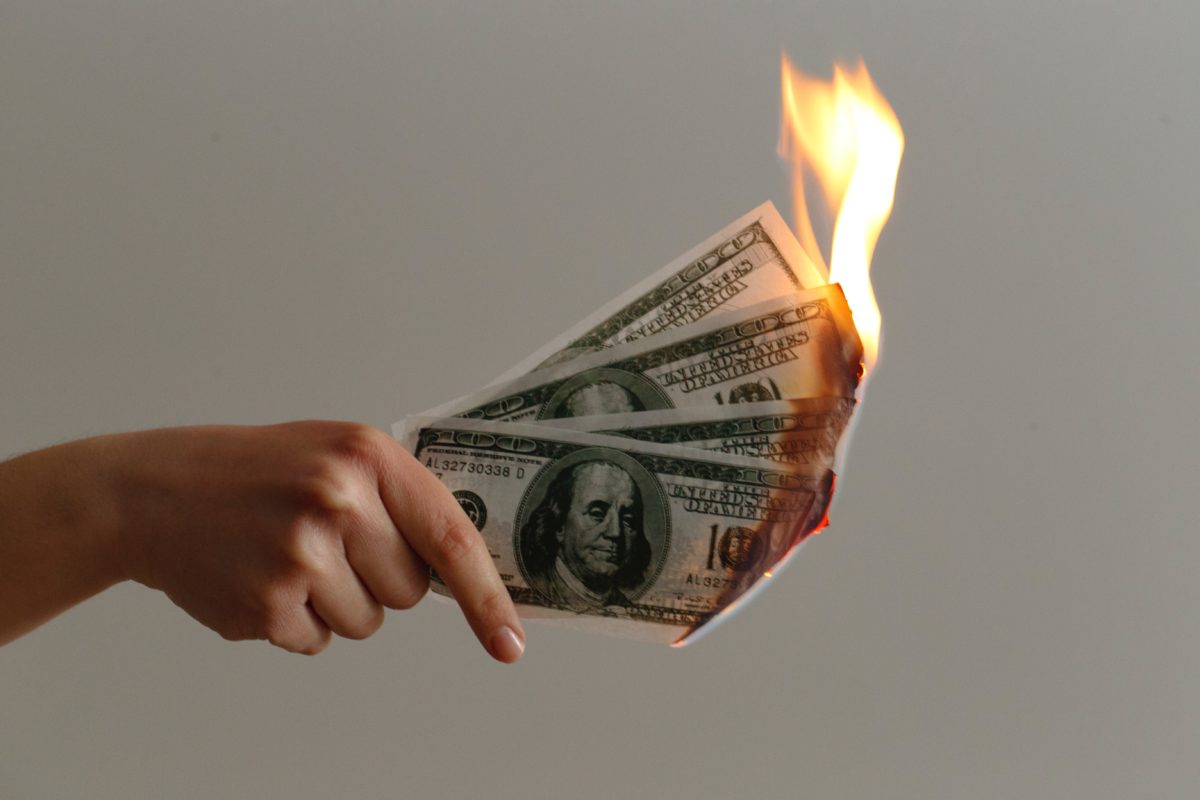 Photo of burning currency by Jp Valery on Unsplash
